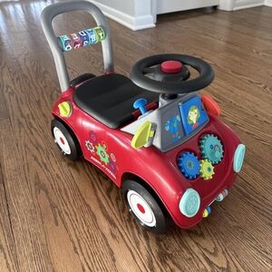 Interactive Red Ride-On Toy Car with Steering Wheel